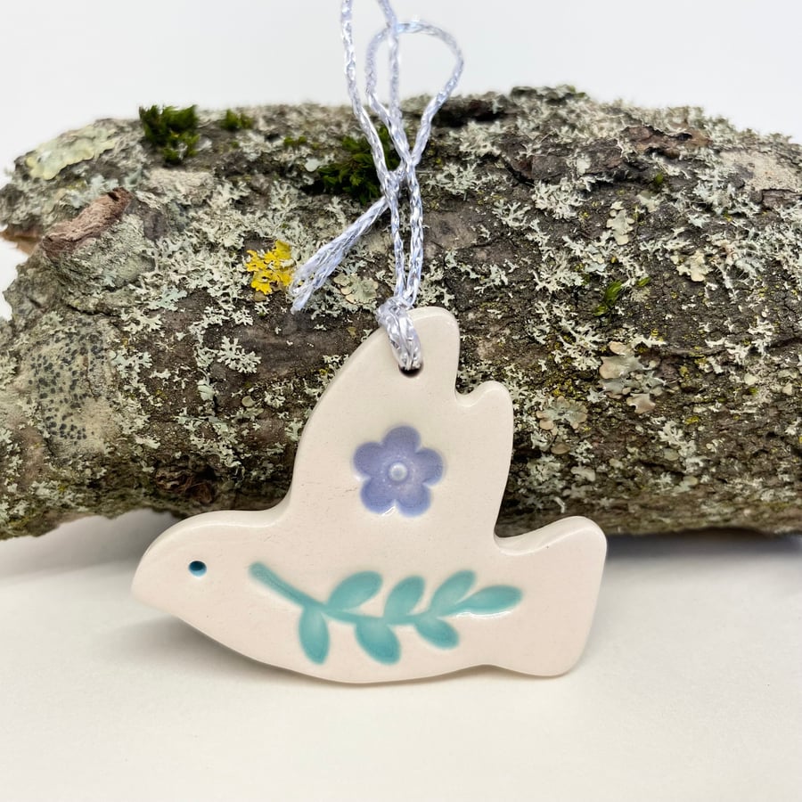 Teeny ceramic dove decoration with leaves and lilac flower