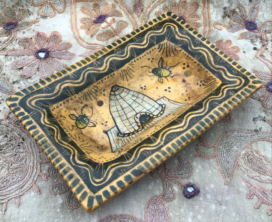 Square slip ware dish with hand painted bee skep
