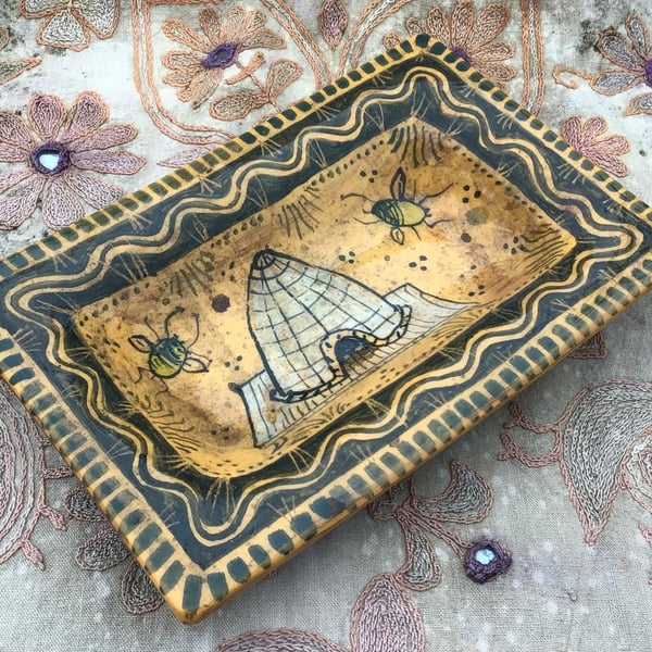 Square slip ware dish with hand painted bee skep