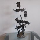 Thistle sculpture with a stone base, hand forged by a scottish blacksmith
