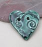 Medium Emerald Green Brocade Texture Heart Shaped Ceramic Button - Image 1