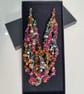 Crocheted necklace in shades of pink, orange, green, lightweight - Image 1