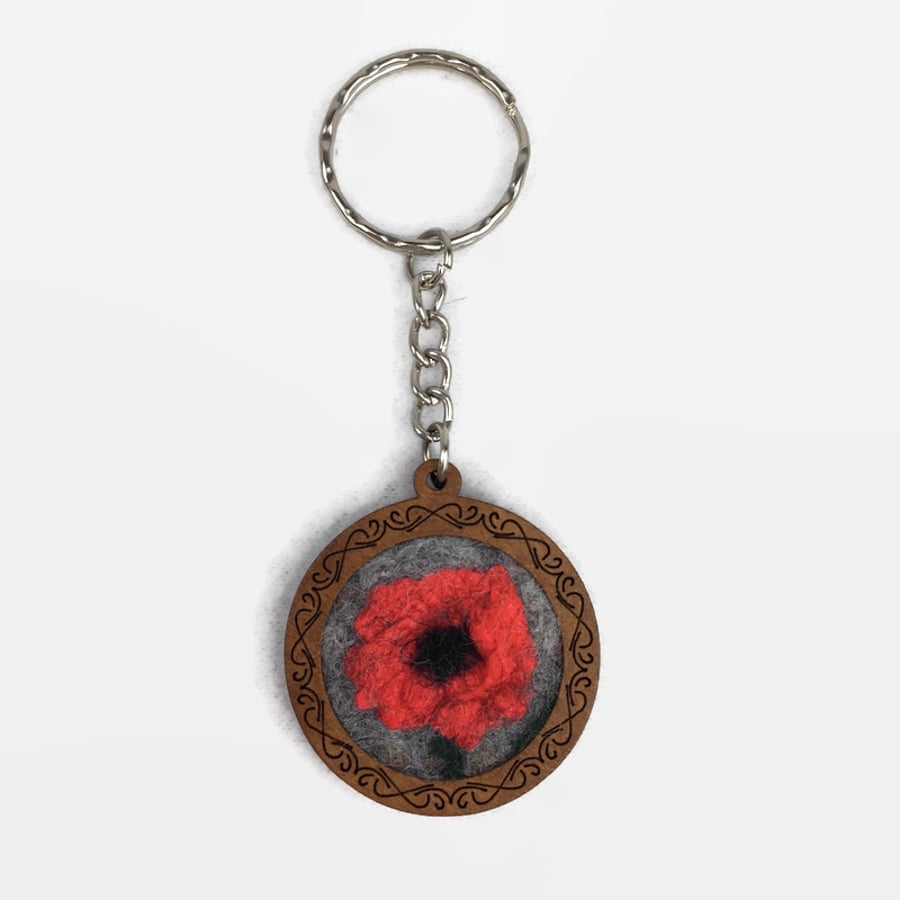 Circular wooden keyring fob with single felted poppy