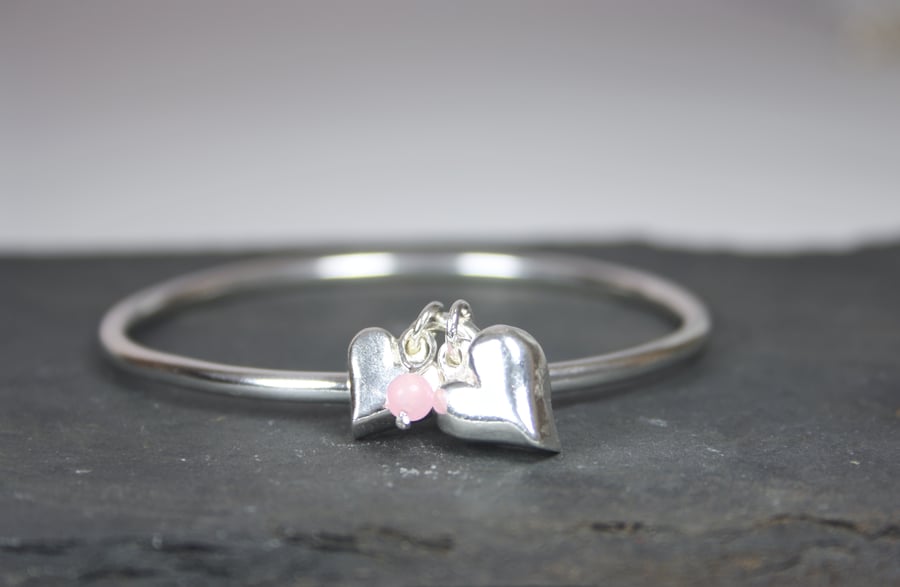 Solid Silver Keepsake Bangle with 2 Heart Charms and Rose Quartz Bead
