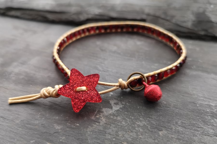 Rich red and gold festive bracelet with glittery star button and jingly bell