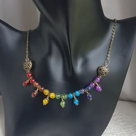 Beautiful Bronze tone Trio bead Rainbow necklace.