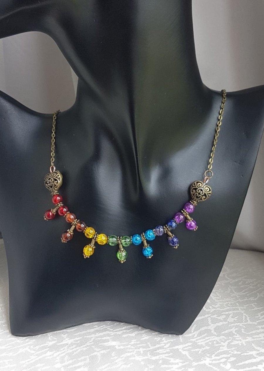 Beautiful Bronze tone Trio bead Rainbow necklace.