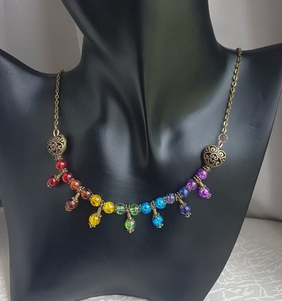 Beautiful Bronze tone Trio bead Rainbow necklace.