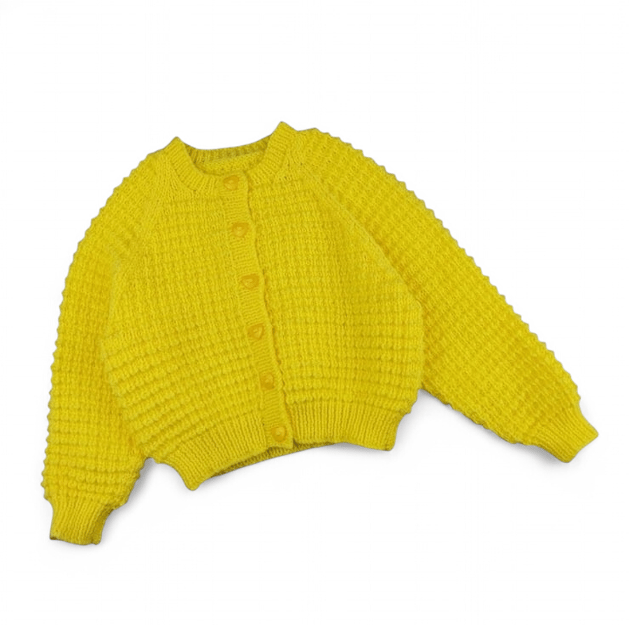 Yellow child's cardigan hand knitted with all over textured pattern 1-2 yrs
