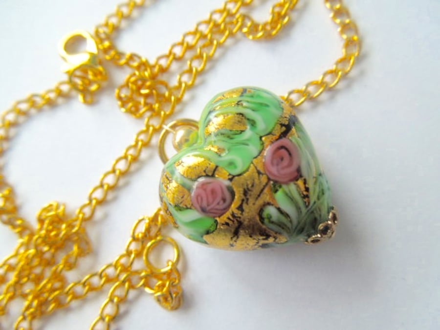 Gold Murano glass handmade rose decorated heart pendant with gold chain.