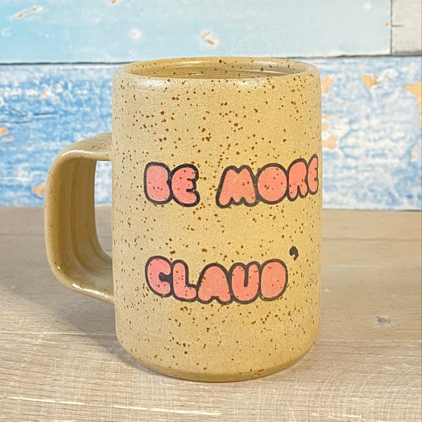 Be more Claude' mug.