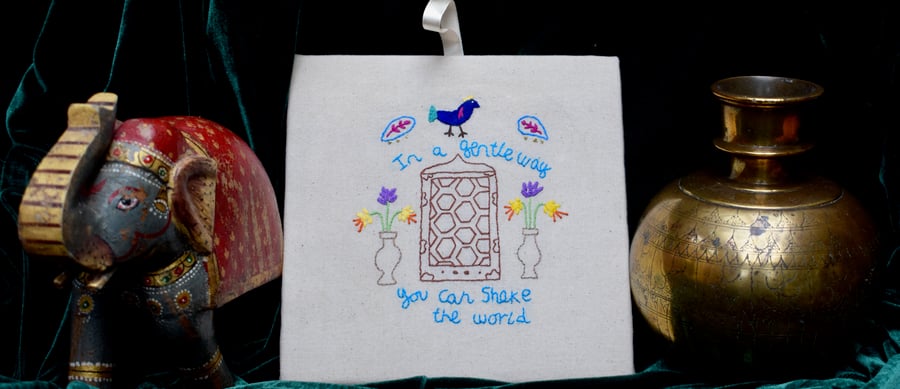 Hand embroidered motivational Gandhi quotation wall art.