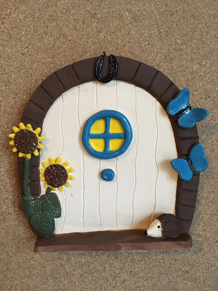 Magical fairy door with sunflowers