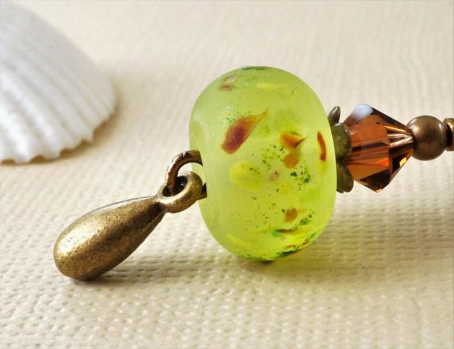 Lime green blossom lampwork bead and Swarovski crystal antique bronze keyring 