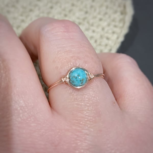 Turquoise gemstone ring in rose gold coloured wire