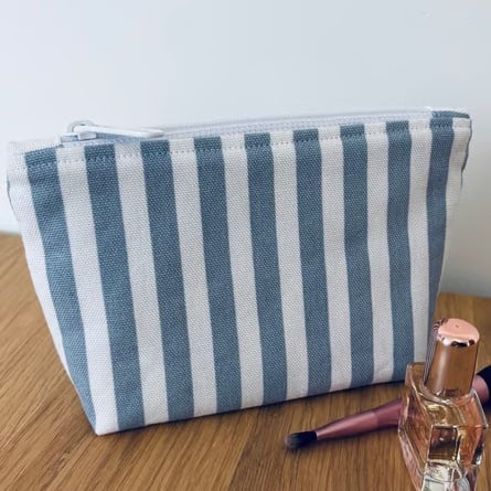 Small cotton makeup bag, pouch, purse, in blue and white stripes.