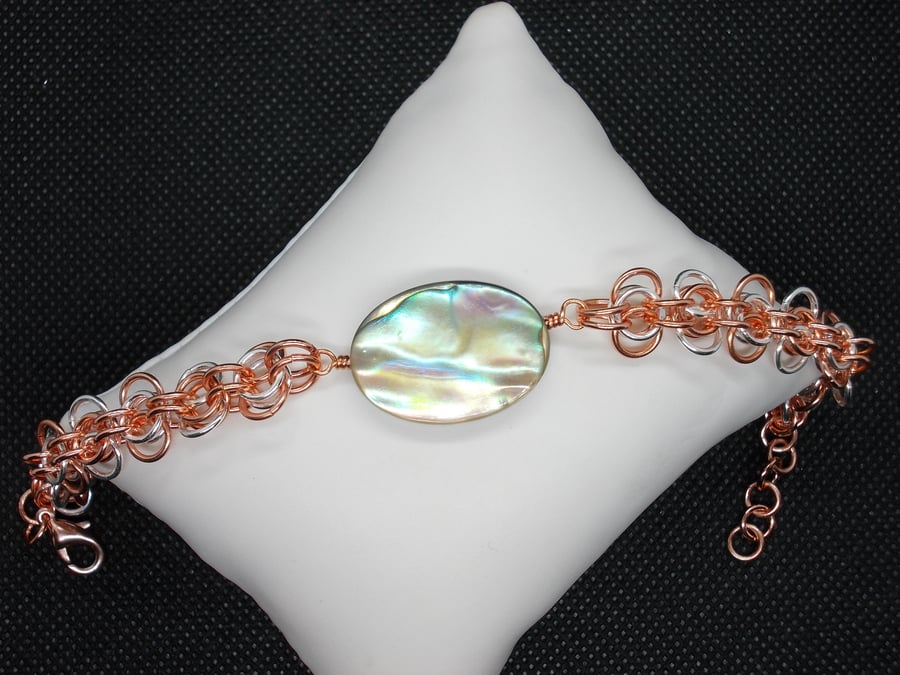 Abalone oval with back to work chainmaille weave