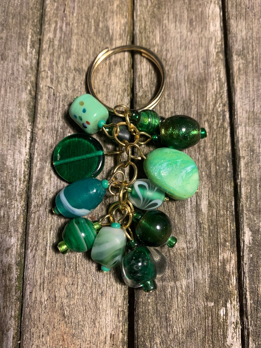 Green glass bead and gold keyring