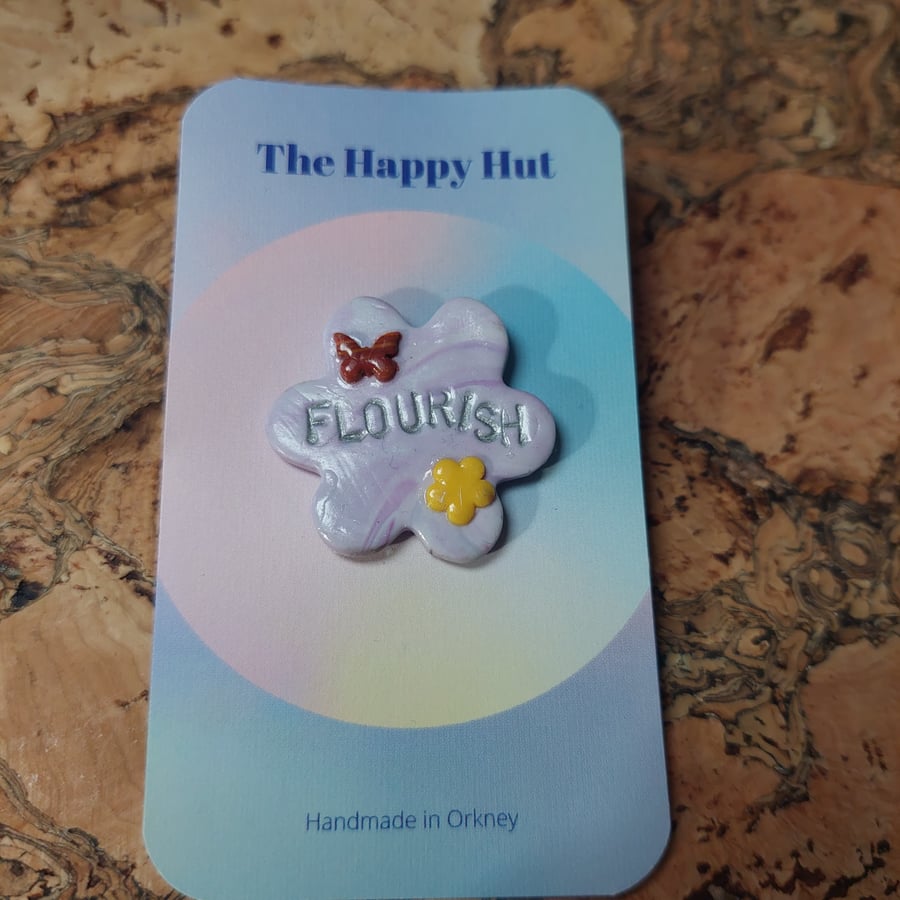 Flourish pin badge