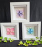Set of three origami flowers in shadow box frames