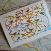 Birds Of A Feather, papercut on vintage map