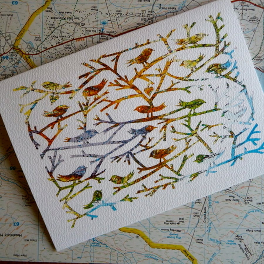 Birds Of A Feather, papercut on vintage map