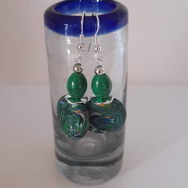 Green multi-coloured dangly earrings