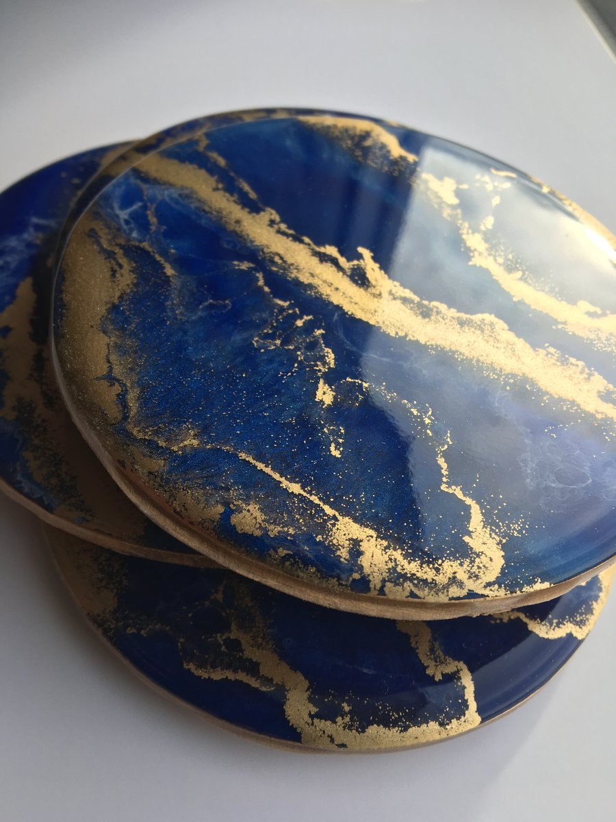 Blue and gold, lightweight, round, coasters, heat and scratch resistant resin