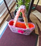 Crochet open bucket bag with crochet flower to the front and a duel inner pocket