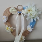 Heart shaped wreath wrapped with burlap and light blue yarn, faux flower decor