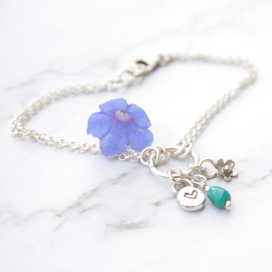 Turquoise and silver charm bracelet