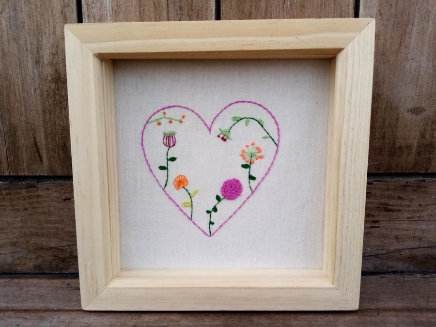 Hand embroidered framed artwork of a heart with flowers Seconds Sunday