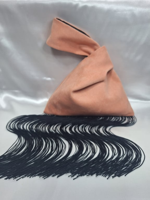 Pink Faux suede Japanese Knot bag with 30cm black tassel trim