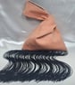 Pink Faux suede Japanese Knot bag with 30cm black tassel trim