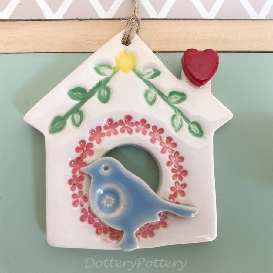 Small Ceramic bird house decoration with pink wreath