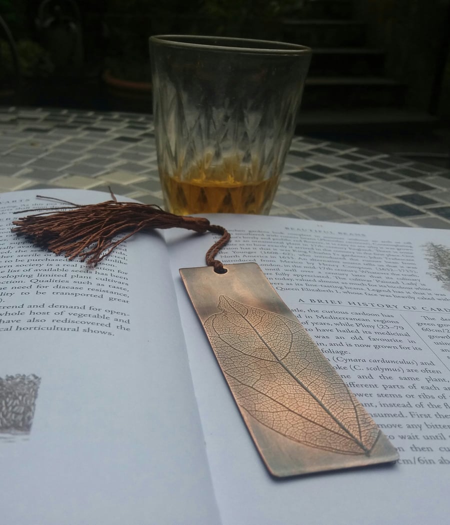 Patinated copper bookmark with leaf pattern