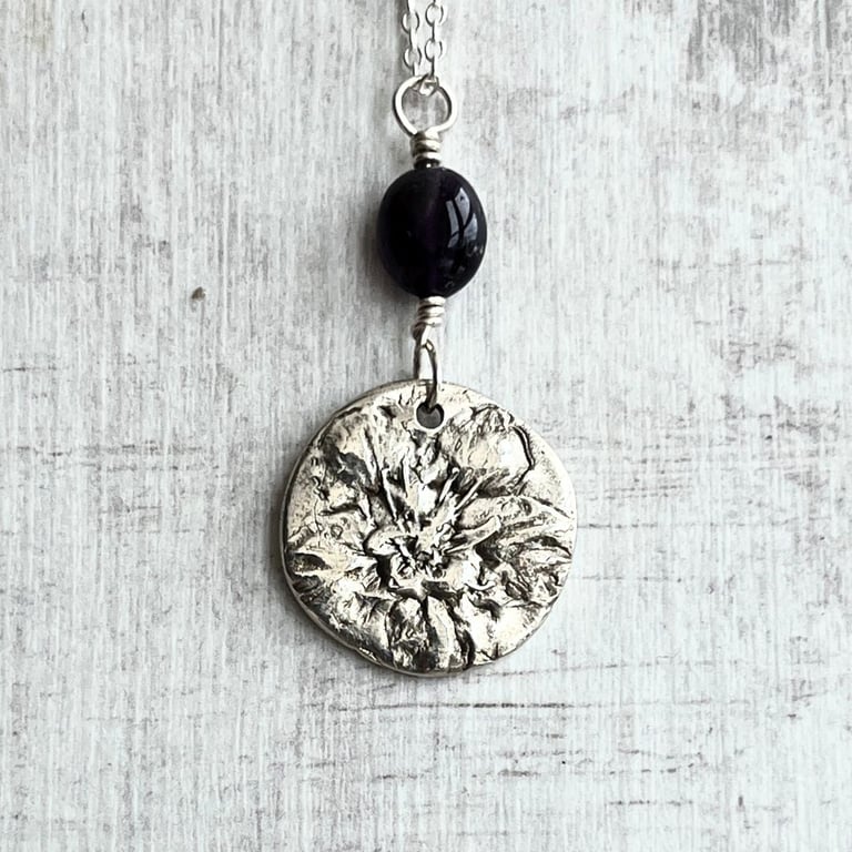 Botanical silver pendant with amethyst on 20 inch silver chain.