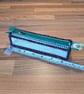 Pencil case - see-through with red, green, navy edge, green zip, yellow charm - Image 2