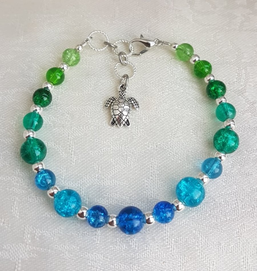 Beautiful Blue and Green Glass Bracelet with Sea Turtle Charm.