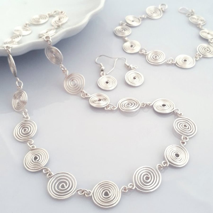 Silver Spiral Jewellery Set, including a necklace, bracelet and earrings, 