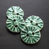 set of four little blue handmade ceramic buttons