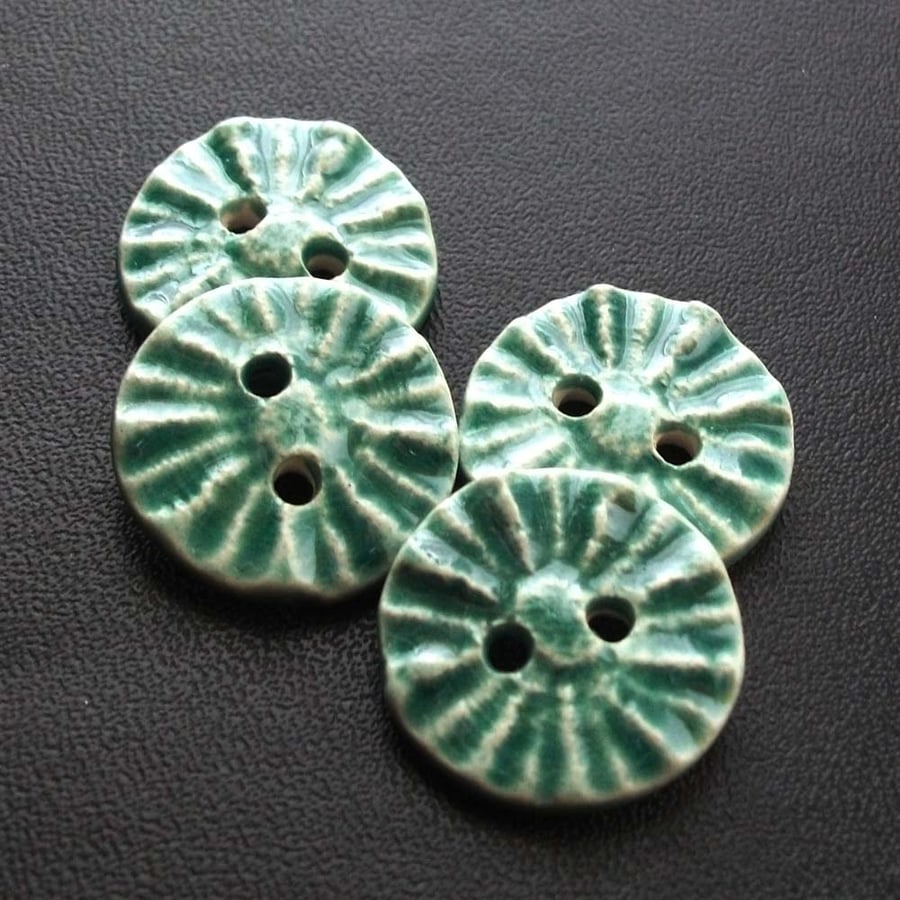 set of four little blue handmade ceramic buttons