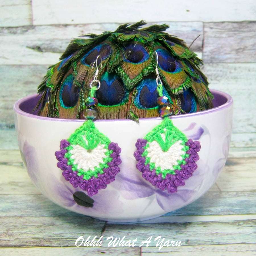 Crochet, embroidered and beaded peacock feather earrings. 