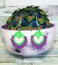 Crochet, embroidered and beaded peacock feather earrings.  - Image 1