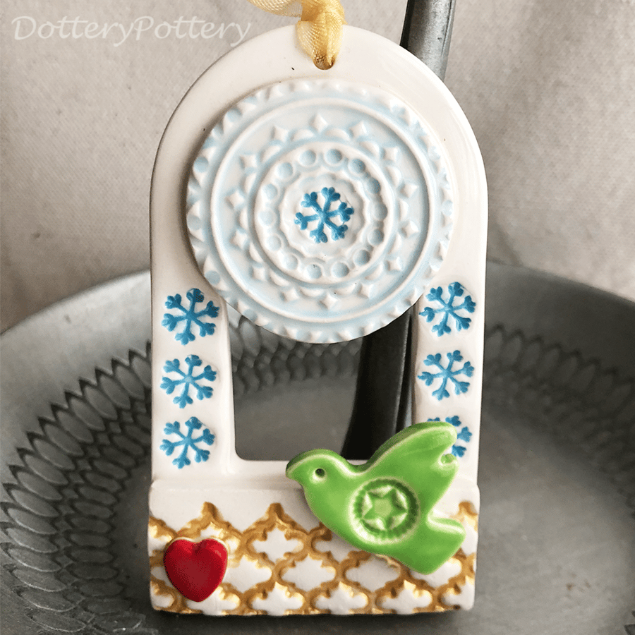 Ceramic decoration with green bird