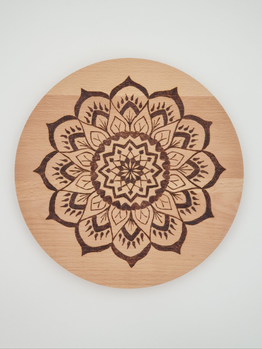 Round wooden chopping board or serving board with pyrography mandala design 
