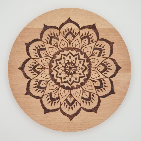Round wooden chopping board or serving board with pyrography mandala design 