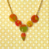 Recycled plastic multi disc orange, yellow & green tree themed necklace