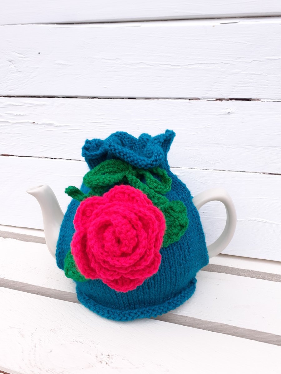 Handknitted Tea Cosy with large Crochet Flower Bright Teal, Pink and Green