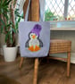 Penguin tote bag in pale blue with a paisley penguin in a purple bobble hat - Image 4
